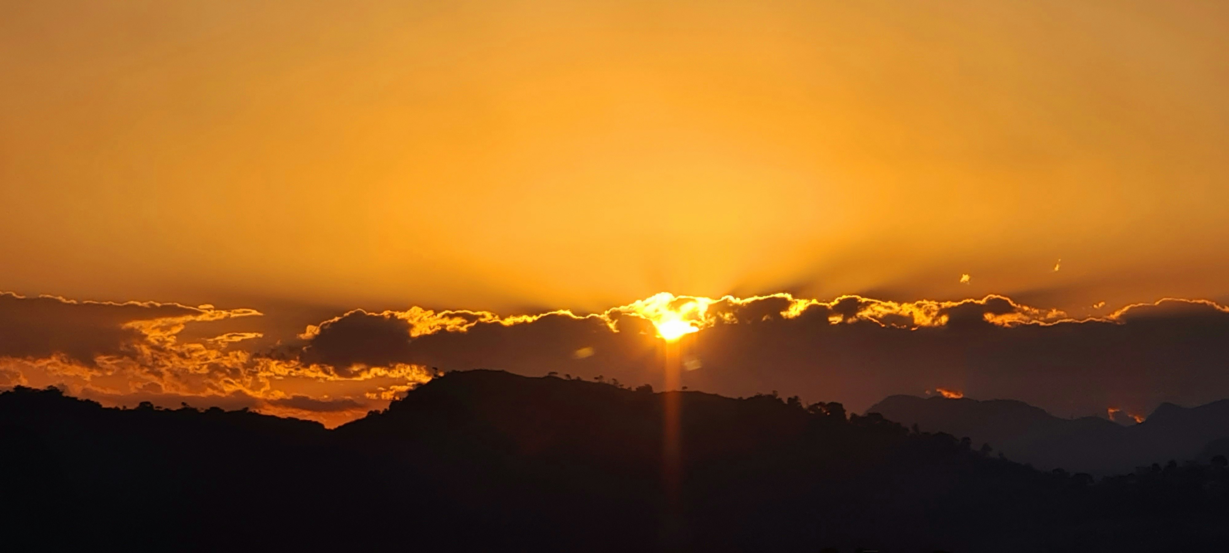 silhouette of mountains during sunset